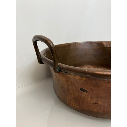 158 - Kitchenalia, a large two two handled copper bowl 48 cm in diameter and 27 cm thigh to the top of the... 