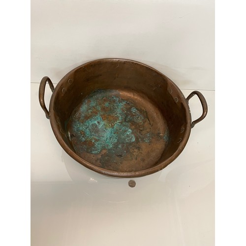 158 - Kitchenalia, a large two two handled copper bowl 48 cm in diameter and 27 cm thigh to the top of the... 