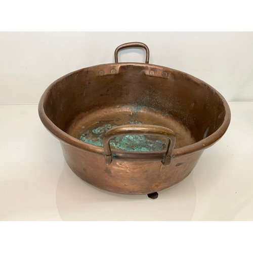 158 - Kitchenalia, a large two two handled copper bowl 48 cm in diameter and 27 cm thigh to the top of the... 