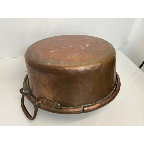 158 - Kitchenalia, a large two two handled copper bowl 48 cm in diameter and 27 cm thigh to the top of the... 