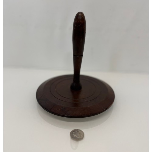 399 - Treen, a large turned mahogany darning mushroom 8 inches in diameter.

This lot is available for in-... 