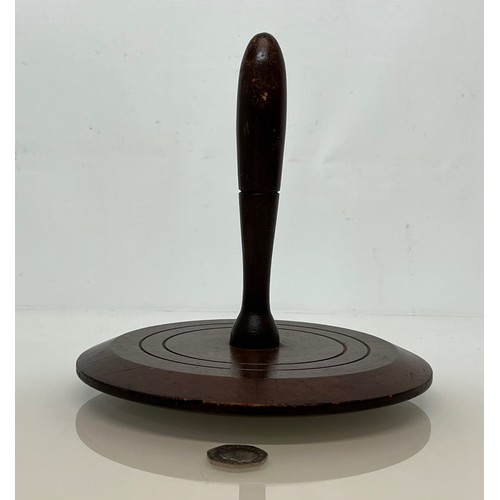 399 - Treen, a large turned mahogany darning mushroom 8 inches in diameter.

This lot is available for in-... 