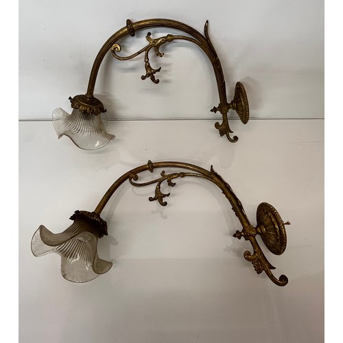 166 - Decorative lighting, a pair of gilded cast brass wall lights, wall to shade length 16 inches overall... 