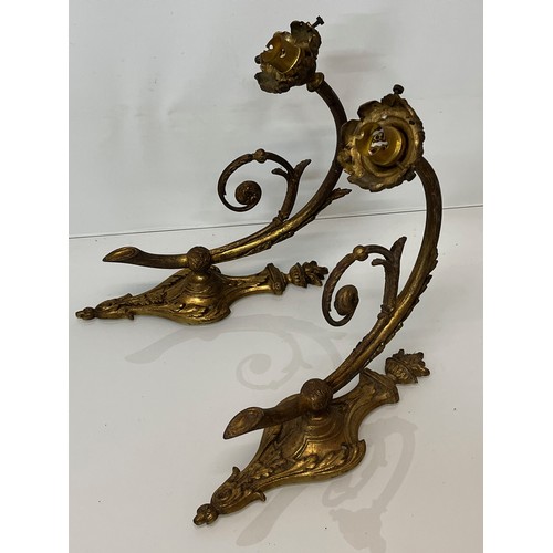 167 - Decorative lighting, a pair of gilded cast brass wall lights, with nicely detailed classical designs... 