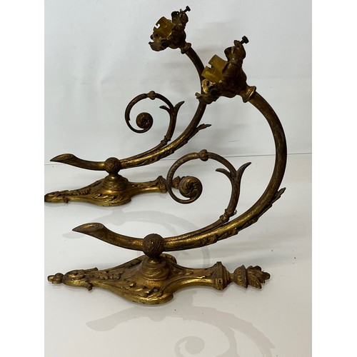 167 - Decorative lighting, a pair of gilded cast brass wall lights, with nicely detailed classical designs... 