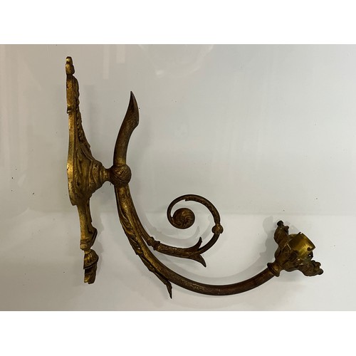 167 - Decorative lighting, a pair of gilded cast brass wall lights, with nicely detailed classical designs... 