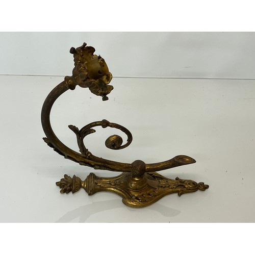 167 - Decorative lighting, a pair of gilded cast brass wall lights, with nicely detailed classical designs... 