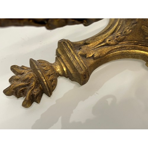 167 - Decorative lighting, a pair of gilded cast brass wall lights, with nicely detailed classical designs... 