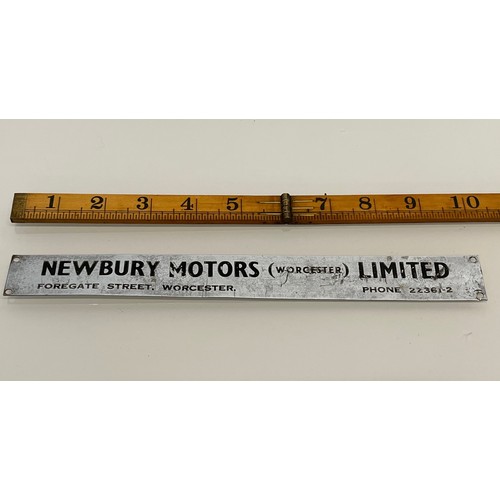 173 - Automobilia, a Newbury Motors Worcester sign for a vintage motor car. 10 inches long.

This lot is a... 