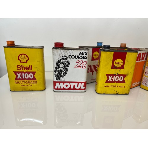 176 - Collection of seven motoring oil cans, shell and other brands.

This lot is available for in-house s... 