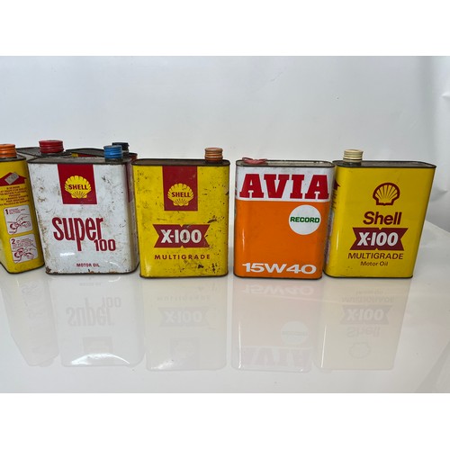 176 - Collection of seven motoring oil cans, shell and other brands.

This lot is available for in-house s... 