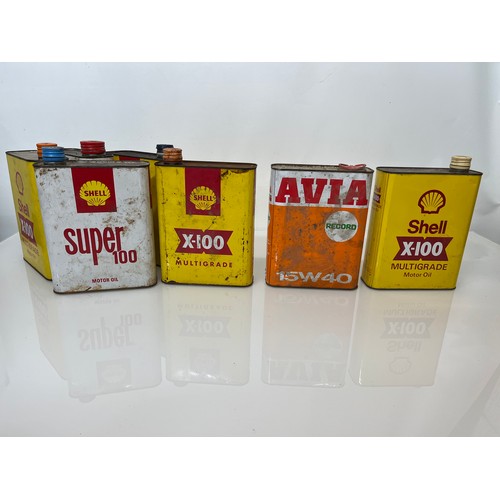 176 - Collection of seven motoring oil cans, shell and other brands.

This lot is available for in-house s... 