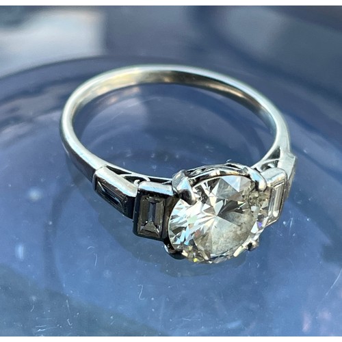 358 - Art Deco Solitaire Diamond ring, on a platinum mounting, the central stone is 8.75 mm diameter and h... 