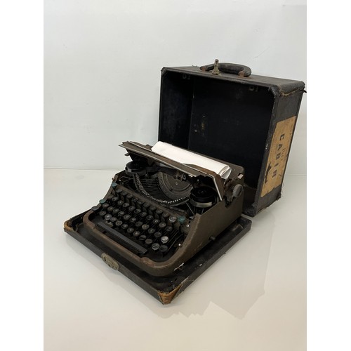 6 - Cased portable typewriter.

This lot is available for in-house shipping