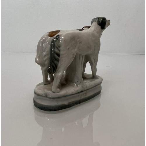 13 - Staffordshire dog figurine, nicely hand decorated and marked to the rear with 2386.

This lot is ava... 