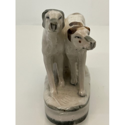 13 - Staffordshire dog figurine, nicely hand decorated and marked to the rear with 2386.

This lot is ava... 