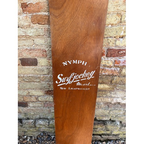 15 - 1960’s vintage wooden surf board, a Nymph Surf Jockey belly board, 120cm long.

This lot is availabl... 