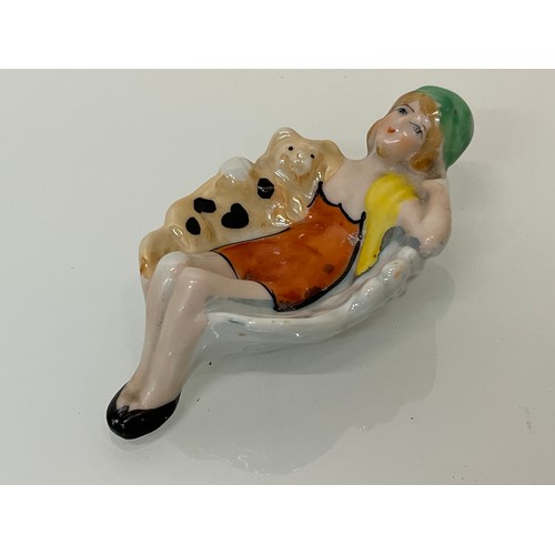 19 - Two kitsch Japanese pottery pin trays hand decorated with reclining female figures. 12 cm long.

Thi... 