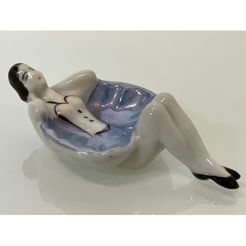 19 - Two kitsch Japanese pottery pin trays hand decorated with reclining female figures. 12 cm long.

Thi... 