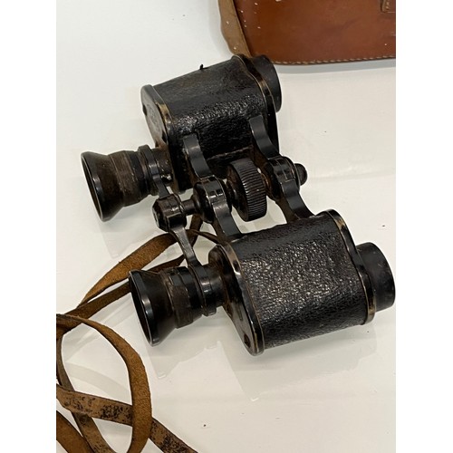 24 - Militaria, a pair of cased WWI German military binoculars, Oigee Oigtur X6 field glasses 

This lot ... 