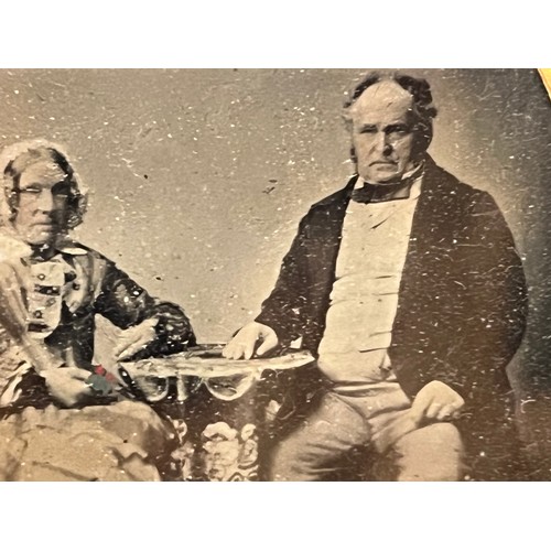 28 - Victorian Daguerreotype photograph of a couple in an gilded oval frame within an velvet lined and em... 