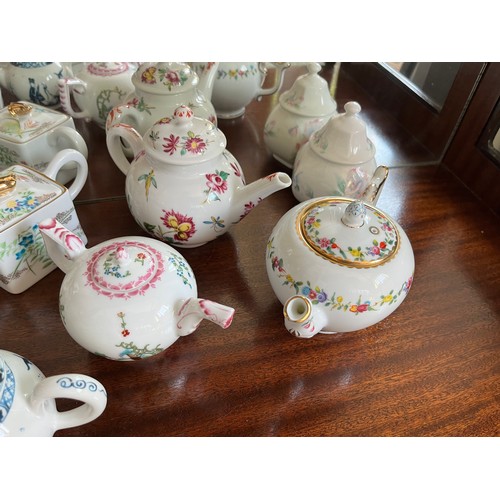 104 - Collection of 10 decorative teapots from a variety of makers.

This lot is available for in-house sh... 