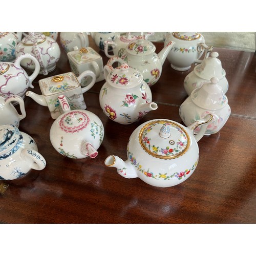 104 - Collection of 10 decorative teapots from a variety of makers.

This lot is available for in-house sh... 