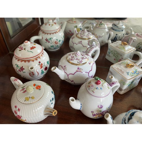 104 - Collection of 10 decorative teapots from a variety of makers.

This lot is available for in-house sh... 