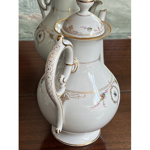 107 - Hand decorated coffee pot with gilded decoration throughout and hand painted floral patterns with be... 