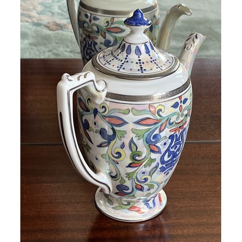 108 - Coalport bone china tea pot from the Elite Platnium range, hand painted by Petronella Britton.

This... 