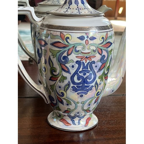 108 - Coalport bone china tea pot from the Elite Platnium range, hand painted by Petronella Britton.

This... 