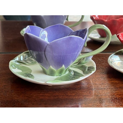 122 - Franz studio ceramics, two flower themed cups and saucers.

This lot is available for in-house shipp... 