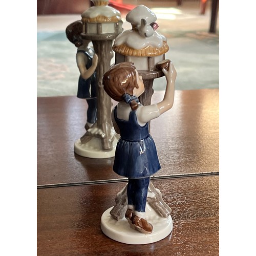 124 - Royal Copenhagen ceramic figure of a girl tending  a bird box.

This lot is available for in-house s... 