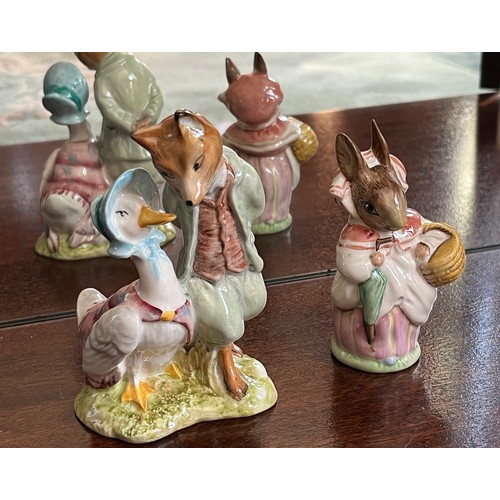 129 - Royal Albert Beatrix Potter figurines of Jemima Puddleduck with Whiskered Gentleman and Mrs Rabbit.
... 