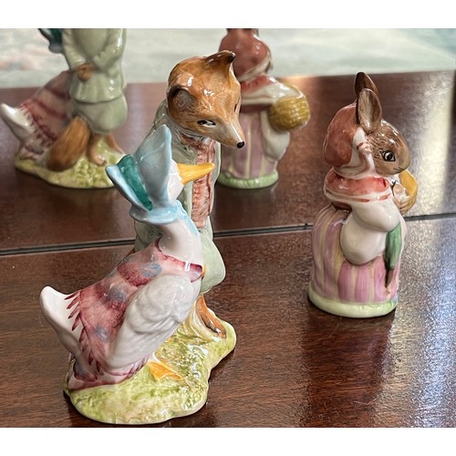 129 - Royal Albert Beatrix Potter figurines of Jemima Puddleduck with Whiskered Gentleman and Mrs Rabbit.
... 