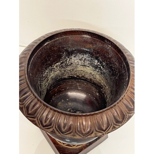 136 - Architectural antiques, a small cast bronze vase with hand chased decoration, previously in use as a... 