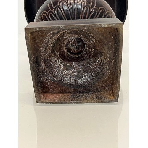 136 - Architectural antiques, a small cast bronze vase with hand chased decoration, previously in use as a... 