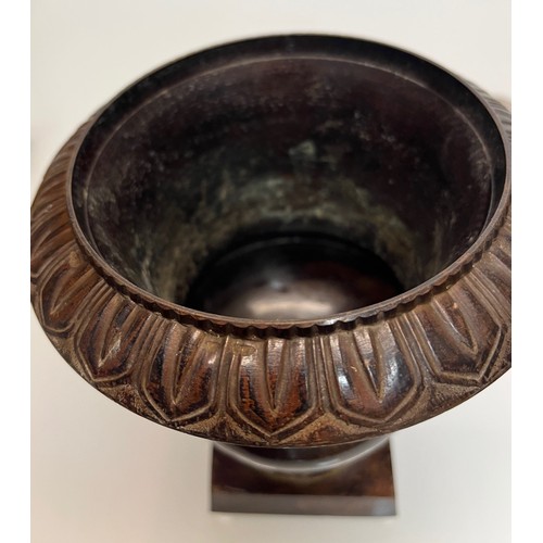 136 - Architectural antiques, a small cast bronze vase with hand chased decoration, previously in use as a... 