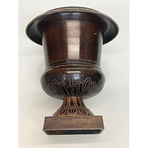 136 - Architectural antiques, a small cast bronze vase with hand chased decoration, previously in use as a... 