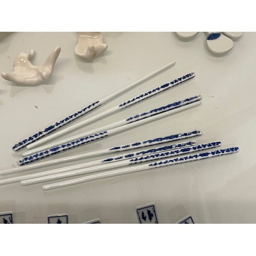 140 - Collection of ceramic chop sticks and rests.

This lot is available for in-house shipping