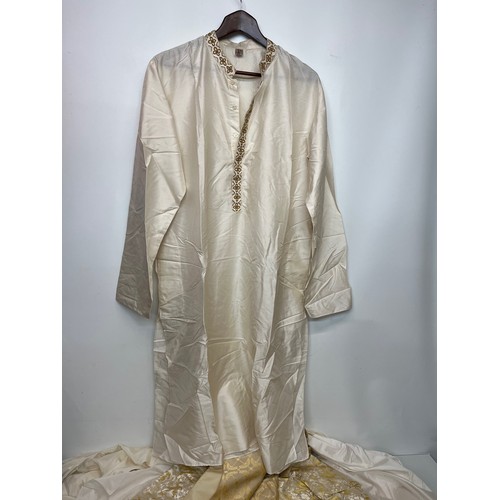 142 - Indian clothing, a collection of men’s and women’s wedding wear.

This lot is available for in-house... 