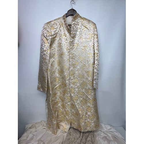 142 - Indian clothing, a collection of men’s and women’s wedding wear.

This lot is available for in-house... 