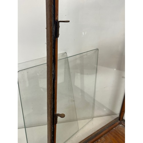 121 - Small counter top shop display case, early C20th, two glass internal shelves and single glazed door ... 