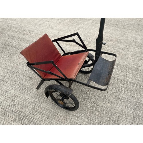 212 - Early C20th child’s folding push chair, original upholstery and enamelled finish.

This lot is avail... 