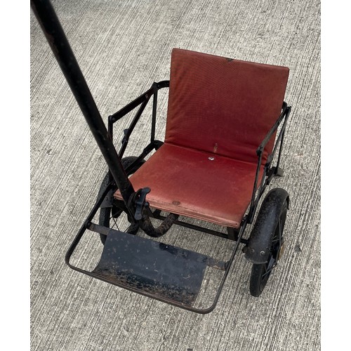 212 - Early C20th child’s folding push chair, original upholstery and enamelled finish.

This lot is avail... 