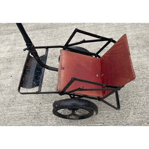 212 - Early C20th child’s folding push chair, original upholstery and enamelled finish.

This lot is avail... 