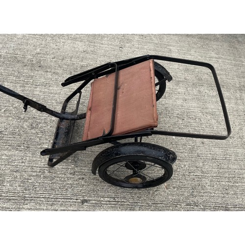 212 - Early C20th child’s folding push chair, original upholstery and enamelled finish.

This lot is avail... 