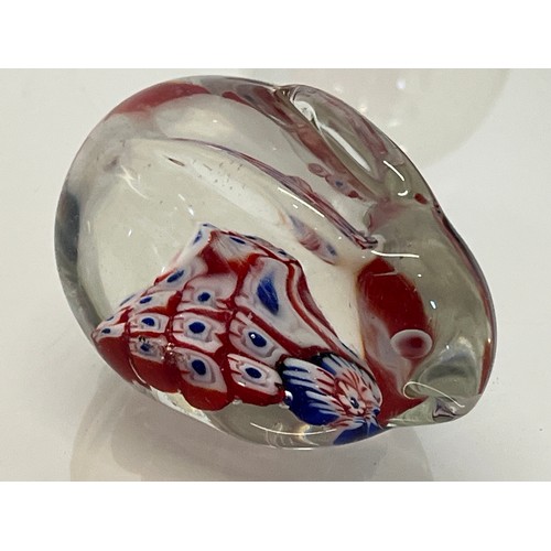 303 - Five decorative glass paper weights.

This lot is available for in-house shipping