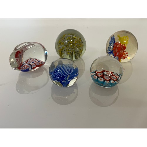 303 - Five decorative glass paper weights.

This lot is available for in-house shipping