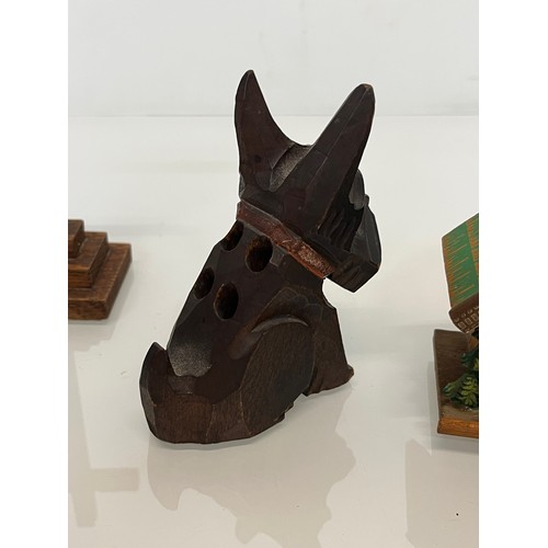 305 - Collection of souvenir treen, a Swiss musical box and barometer, a carved terrier dog pen stand and ... 